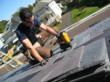 Installing DaVinci polymer roofing tiles.